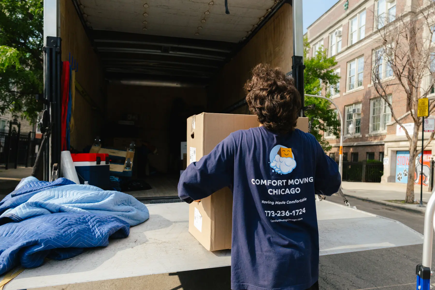 Comfort Moving Chicago crew loading boxes into a large moving truck