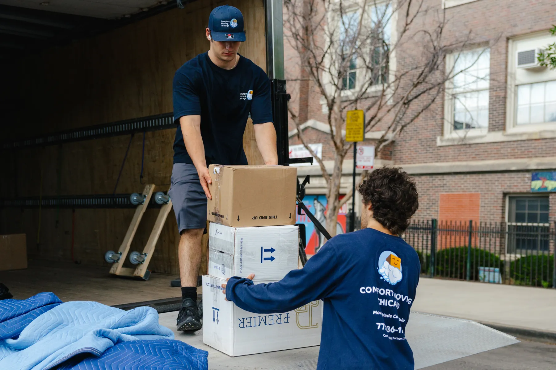Comfort Moving Chicago crew loading boxes into a moving truck